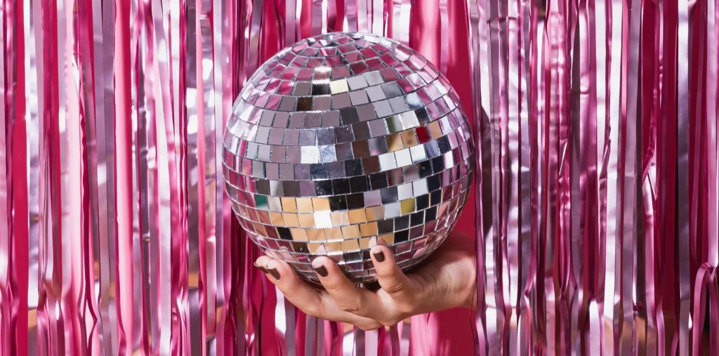 glitter ball in front of pink ribbons crop sm
