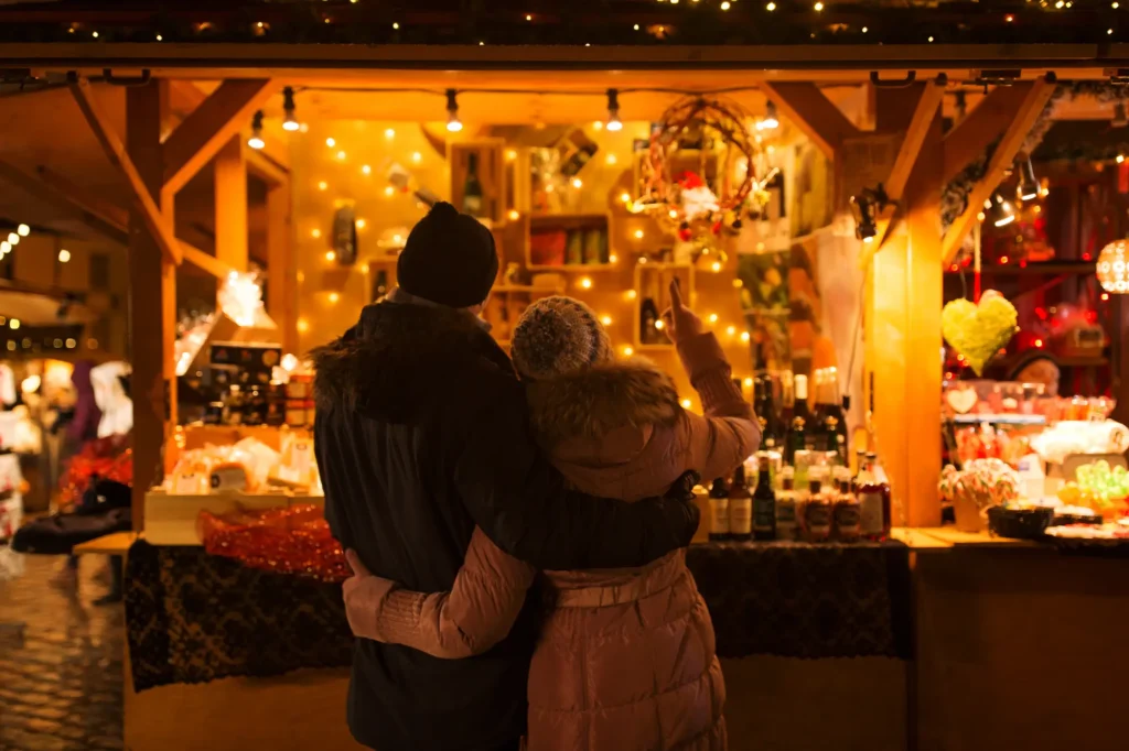 Couple looking at a stall in a Christmas Market