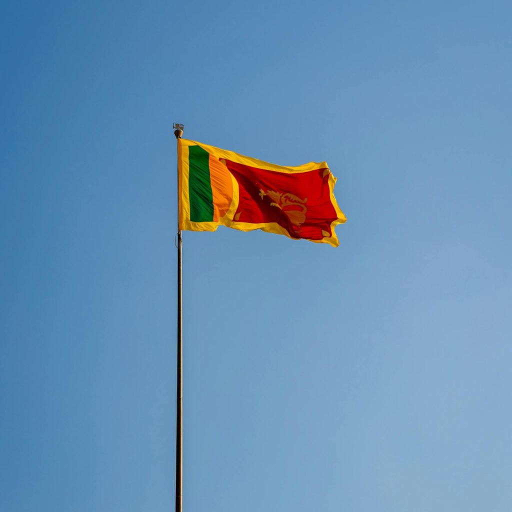 Vibrant Sri Lankan flag waving against a clear blue sky in Colombo, Western Province.